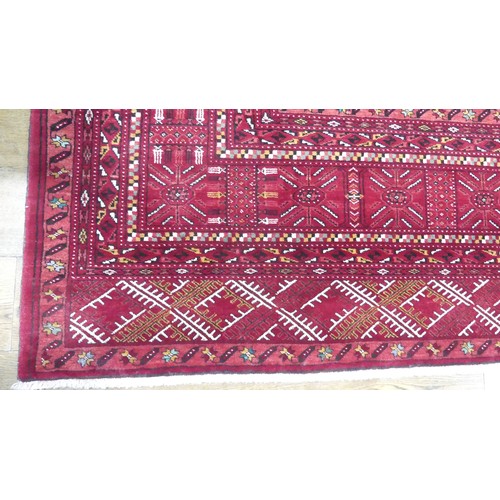 642 - Tribal Rugs; a good finely knotted red ground Turkomen carpet, wool pile on wool base, three rows of... 