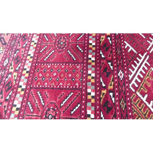 642 - Tribal Rugs; a good finely knotted red ground Turkomen carpet, wool pile on wool base, three rows of... 