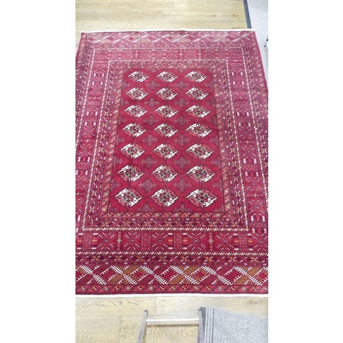 642 - Tribal Rugs; a good finely knotted red ground Turkomen carpet, wool pile on wool base, three rows of... 