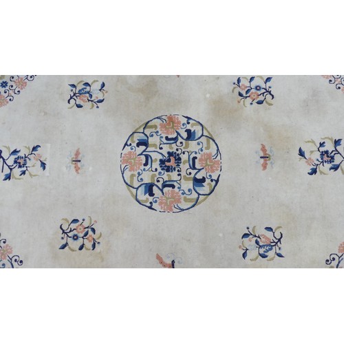 639 - Hand-knotted Rugs; an old Chinese cream ground carpet, the centre with floral sprays and butterflies... 