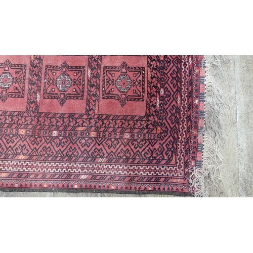 643 - Tribal Rugs; a light-red ground Afghan rug, wool pile on wool base, 219cm x 126cm, good overall cond... 