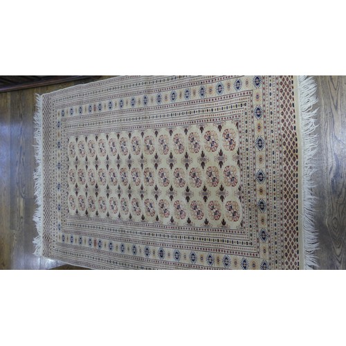 644 - Tribal rugs; an old hand-knotted Bokhara rug, fine wool pile on a cotton base, 196cm x 130cm, good c... 