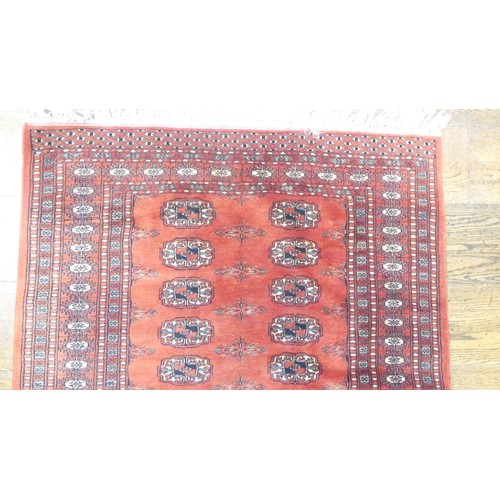 646 - Tribal rugs; an finely-knotted red ground Bokhara rug, wool pile on a cotton base, 170cm x 98cm, goo... 