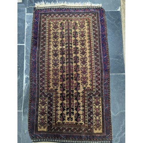 649 - Tribal Rugs; an old Baluchi Prayer Rug, 100% wool, 128cm x 74cm, pile slightly worn.... 