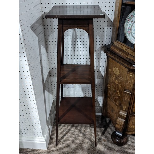 328 - An Arts and Crafts mahogany square Torchere / Plant Stand, three shelves raised on square tapering l... 