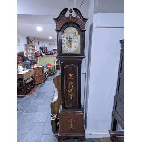 304 - An inlaid mahogany Longcase Clock with arched brass dial, silvered chapter ring with arabic numerals... 