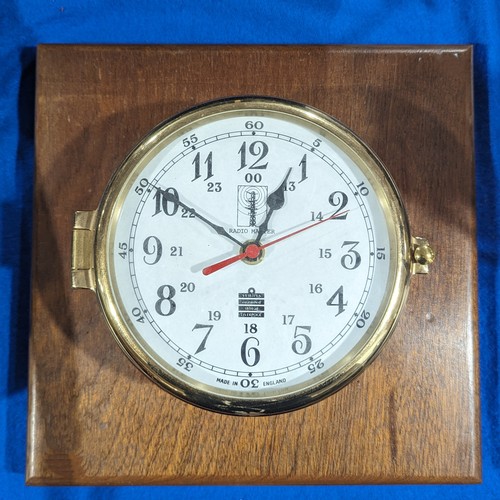 299 - A brass mounted Sewills Radio Master port-hole Clock, Liverpool, battery operated, W 26.5 cm x H 10 ... 