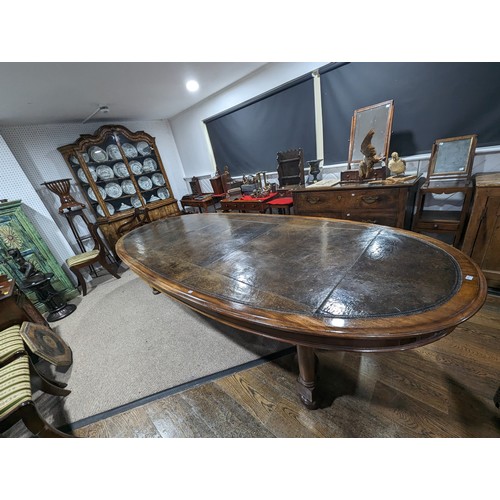 619 - An unusual Victorian oval Library Table / boardroom Table, with gilt tooled leather skived top, rais... 