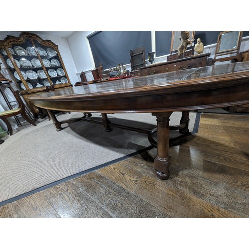 619 - An unusual Victorian oval Library Table / boardroom Table, with gilt tooled leather skived top, rais... 