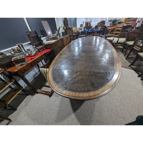 619 - An unusual Victorian oval Library Table / boardroom Table, with gilt tooled leather skived top, rais... 