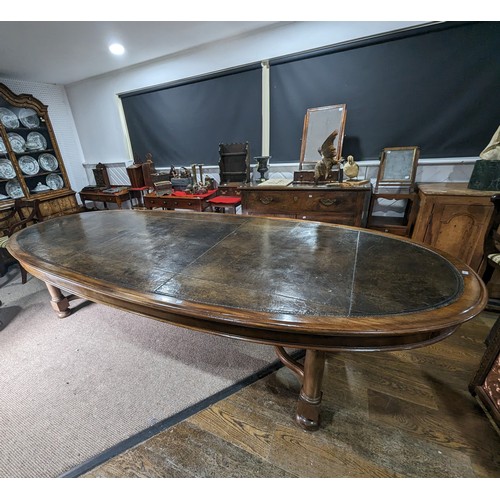 619 - An unusual Victorian oval Library Table / boardroom Table, with gilt tooled leather skived top, rais... 