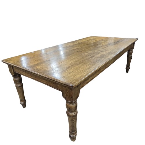 358 - An early 20th century oak Farmhouse Kitchen Table, five plank rectangular moulded top raised on four... 