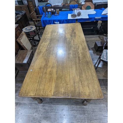 358 - An early 20th century oak Farmhouse Kitchen Table, five plank rectangular moulded top raised on four... 