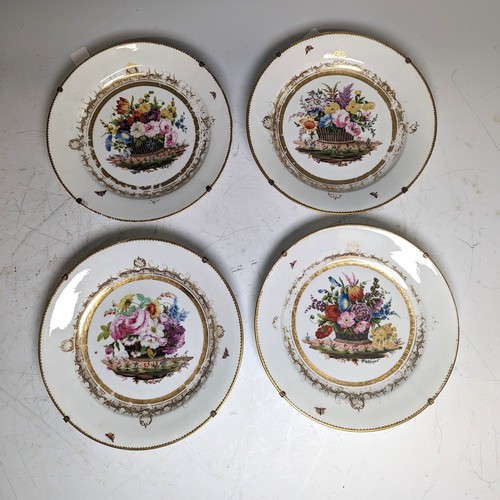 111 - Attributed to Nantgarw: a set of four circular porcelain plates, each painted with a basket of flowe... 