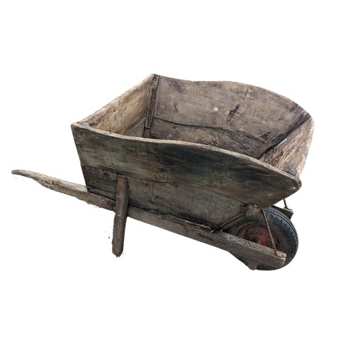 652 - A weathered decorative large wooden garden Wheelbarrow, note lots of wear, W 77 cm x H 89 cm x D 155... 