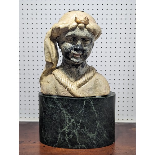 692 - A painted plaster Centerpiece, depicting a man on marble style base, H 53 cm.