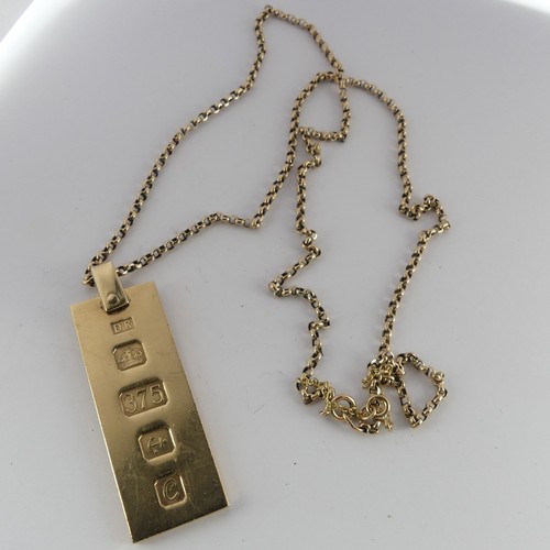 296 - A 9ct yellow gold Ingot Pendant, hallmarked London, 1977, on 9ct gold chain, the chain 62.5cm long, ... 