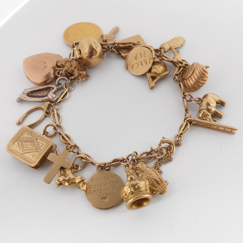 320 - A 9ct yellow gold Charm Bracelet, with bolt ring clasp, suspended with a Victorian half sovereign, d... 