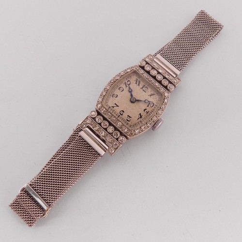 An 18ct white gold and diamond lady's Art Deco Cocktail Watch,with Vertex 17-jewels movement, on an 18ct white gold adjustable mesh bracelet strap, the case 19mm wide, the reverse initialled, gross total weight 28.4g, running.