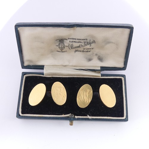 355 - A pair of 18ct yellow gold oval Cufflinks, one side monogrammed, chain between, total weight 20g.... 