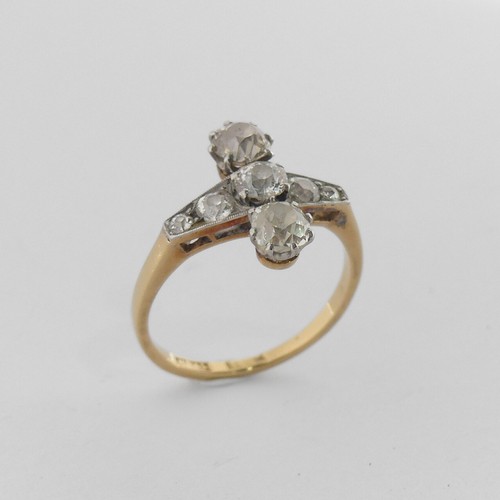 283 - A diamond Ring, the front with a graduated row of five old cut stones, the centre stone approx. 0.25... 