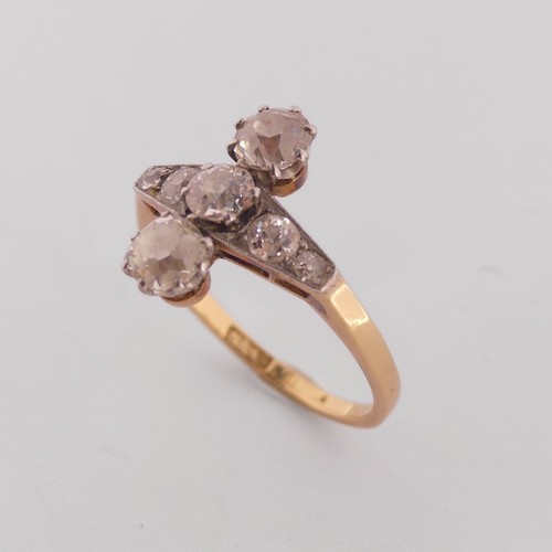 283 - A diamond Ring, the front with a graduated row of five old cut stones, the centre stone approx. 0.25... 