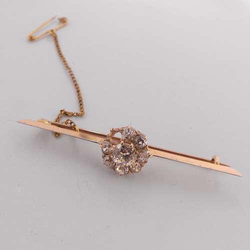 332 - A diamond set Bar Brooch, the centre with an old cut stone approx. 0.6ct, claw set within a cluster ... 