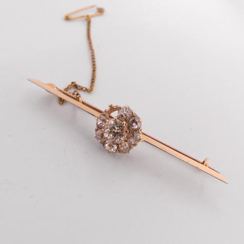 332 - A diamond set Bar Brooch, the centre with an old cut stone approx. 0.6ct, claw set within a cluster ... 