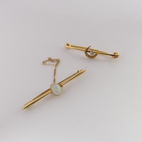 334 - A 15ct yellow gold Bar Brooch, the centre with a cabochon oval opal approx. 8.6mm long, the bar, 5.5... 