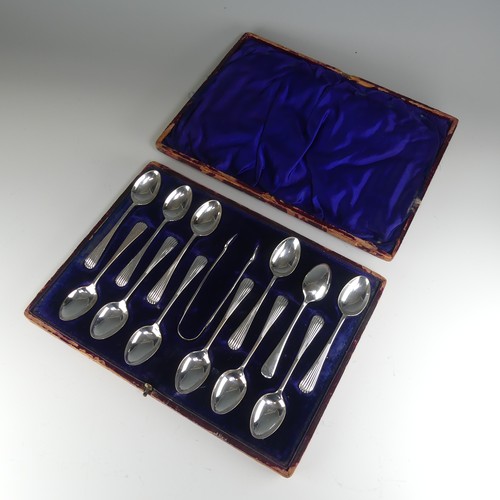 23 - A cased set of twelve late Victorian silver Teaspoons with Sugar Nips, by James Dixon & Sons Ltd... 