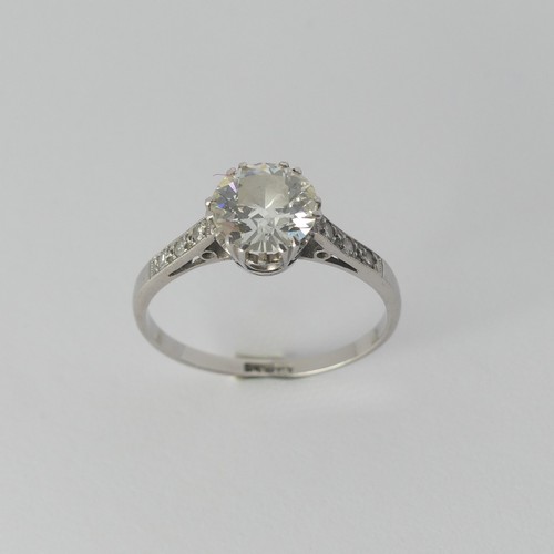 286 - A diamond solitaire Ring, the circular stone approx. 1.3ct (7.3mm x 4.04mm) claw set with three mill... 