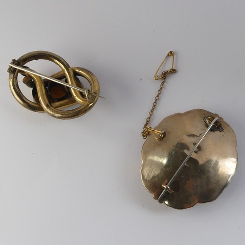 336 - A Victorian Mourning Brooch, of shaped oval form, the centre with box and glass set with woven hair,... 