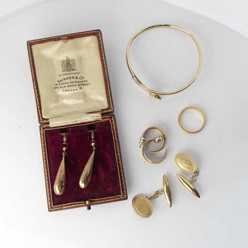 349 - A pair of 9ct gold Cufflinks, the oval fronts with bullet reverses, together with a 9ct gold bangle ... 