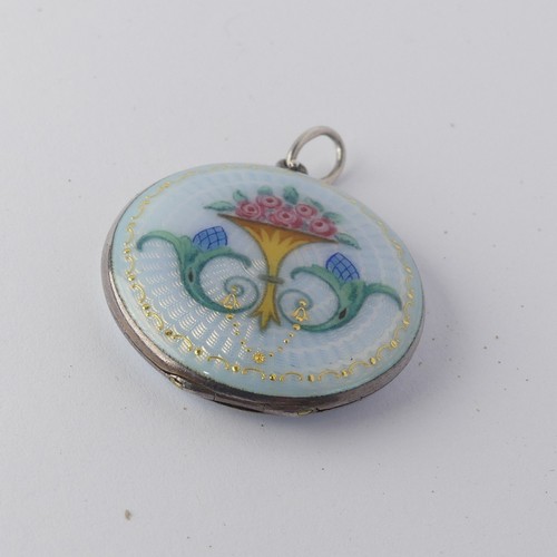 295 - An enamelled circular Pendant Locket, the front with foliate decoration, the reverse with guilloche ... 