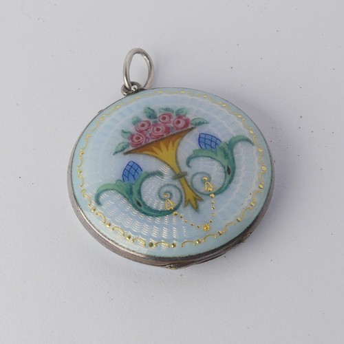 295 - An enamelled circular Pendant Locket, the front with foliate decoration, the reverse with guilloche ... 