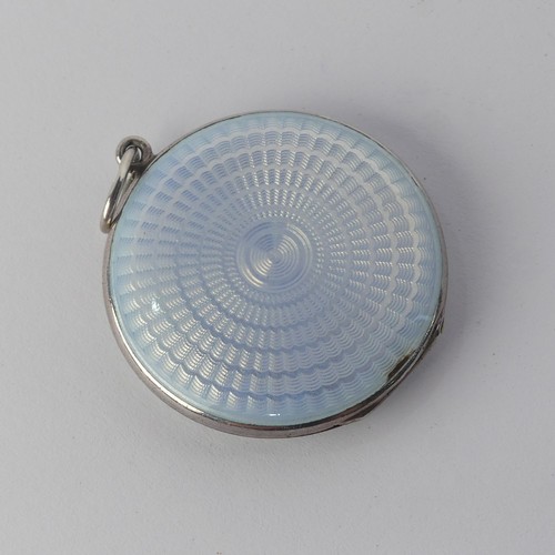 295 - An enamelled circular Pendant Locket, the front with foliate decoration, the reverse with guilloche ... 