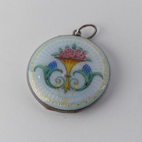 295 - An enamelled circular Pendant Locket, the front with foliate decoration, the reverse with guilloche ... 