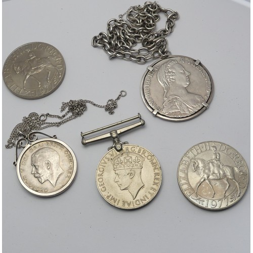 352 - A George V Half Crown, dated 1916, in silver pendant mount, together with a mounted Thaler, dated 17... 