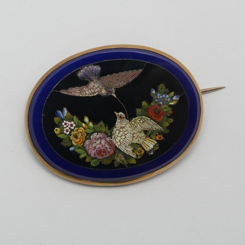 A 19thC Grand Tour Micro-mosaic Brooch, depicting two doves amongst flowers on a black ground within blue surround, all within gold oval frame, tested as 18ct gold, 4.2cm wide.