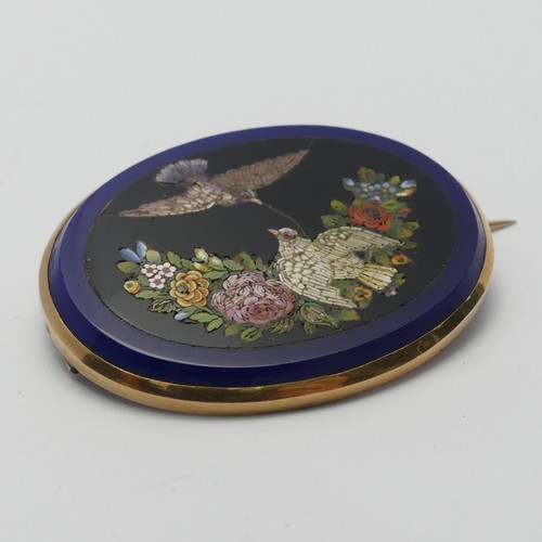 326 - A 19thC Grand Tour Micro-mosaic Brooch, depicting two doves amongst flowers on a black ground within... 