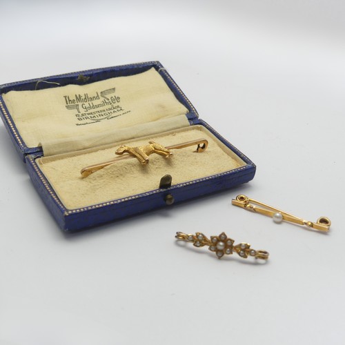 325 - A cased 9ct yellow Bar Brooch, the centre set with a terrier, 5cm long, together with two small seed... 