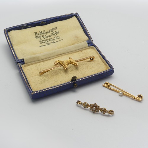 325 - A cased 9ct yellow Bar Brooch, the centre set with a terrier, 5cm long, together with two small seed... 