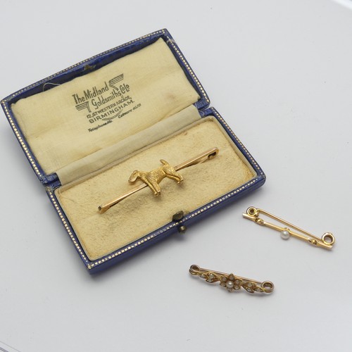 325 - A cased 9ct yellow Bar Brooch, the centre set with a terrier, 5cm long, together with two small seed... 