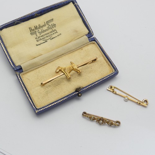 325 - A cased 9ct yellow Bar Brooch, the centre set with a terrier, 5cm long, together with two small seed... 