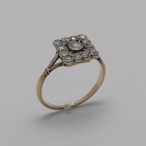 273 - A small Art Deco diamond cluster Ring, the squared front with central diamond within a surround of s... 