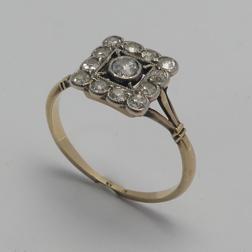 273 - A small Art Deco diamond cluster Ring, the squared front with central diamond within a surround of s... 