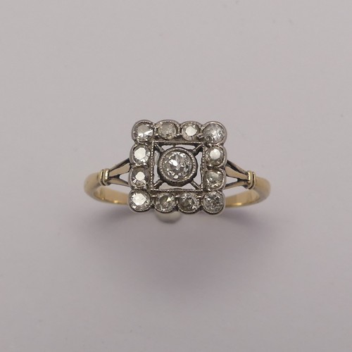 273 - A small Art Deco diamond cluster Ring, the squared front with central diamond within a surround of s... 