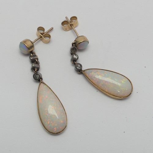 327 - A pair of opal drop Earrings, the pear shaped stones approx. 17.8mm long collet set in yellow gold b... 