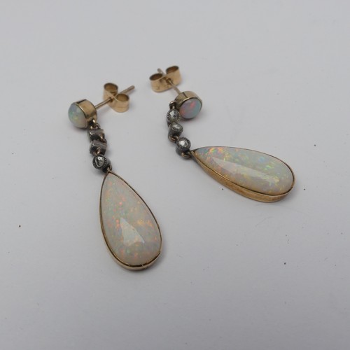 327 - A pair of opal drop Earrings, the pear shaped stones approx. 17.8mm long collet set in yellow gold b... 