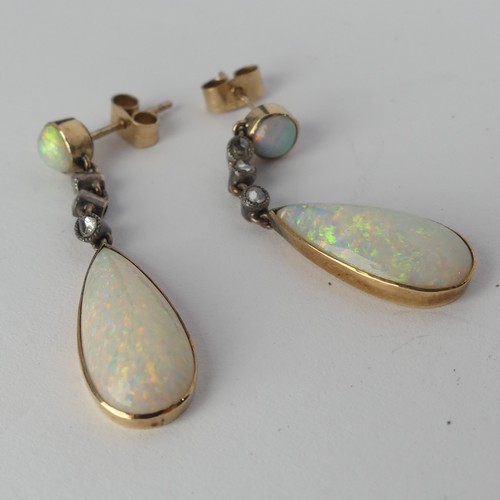 327 - A pair of opal drop Earrings, the pear shaped stones approx. 17.8mm long collet set in yellow gold b... 